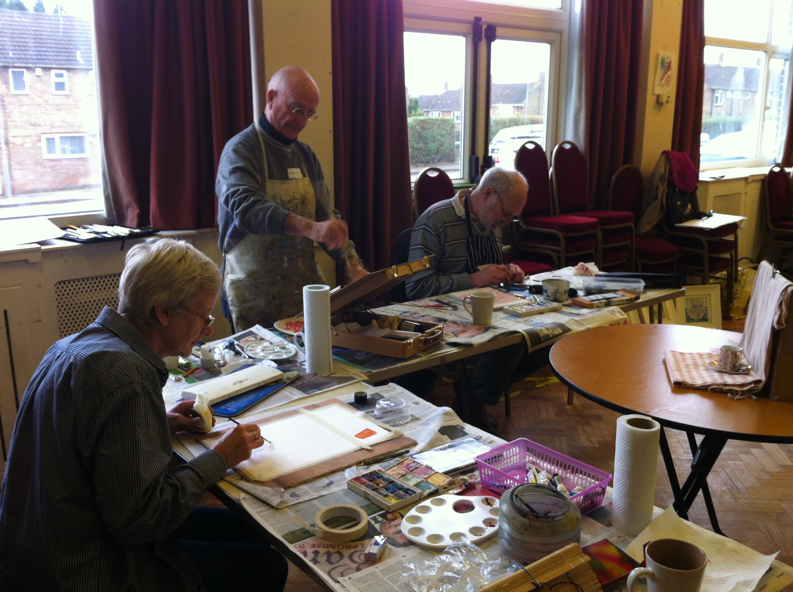 Linda, Brendan and Greg absorbed in their work.