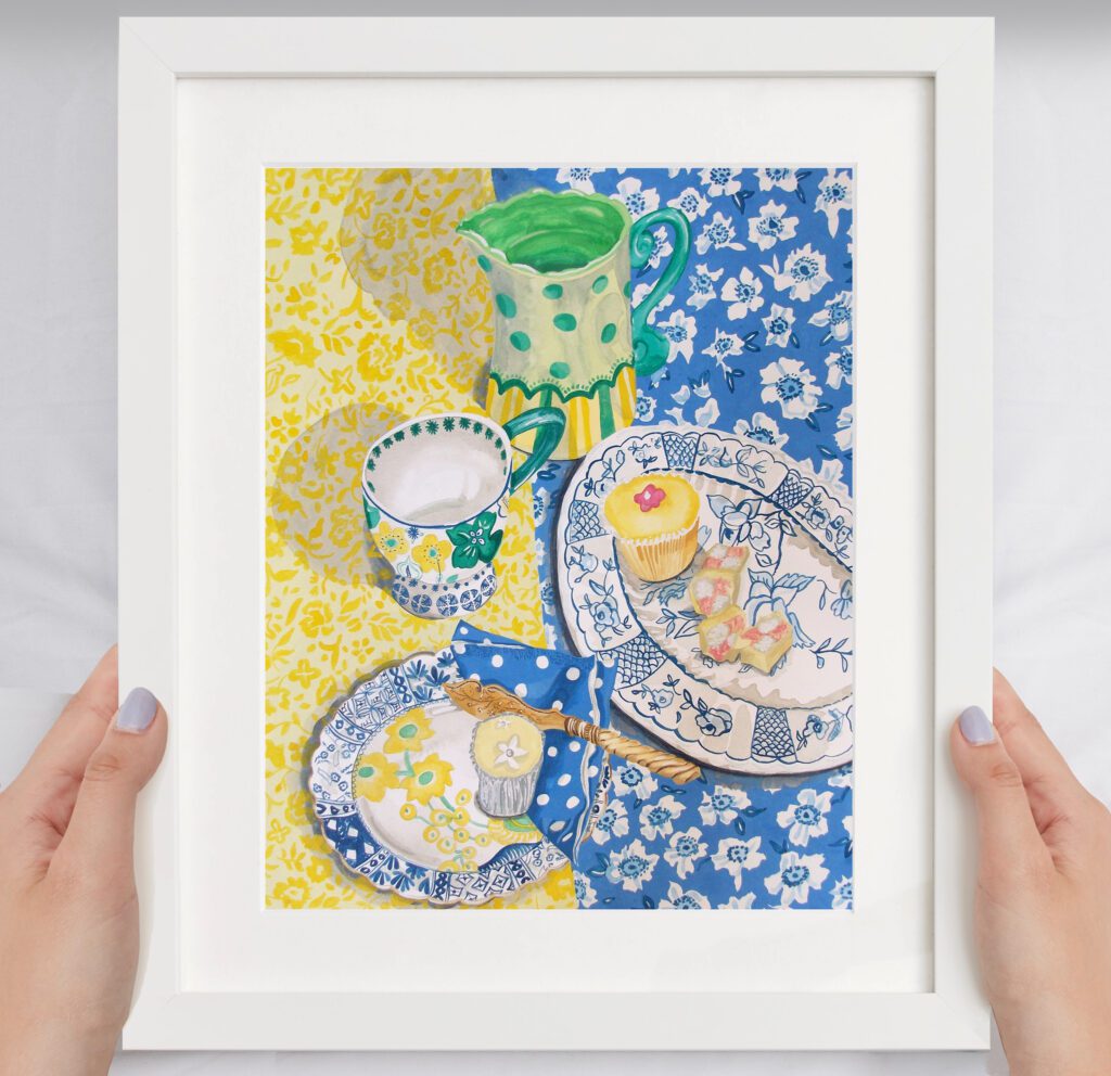 Tea Table an original painting by Claire Leggett. Two hands holding a mocked up image of Tea Table - an original painting by Claire Leggett